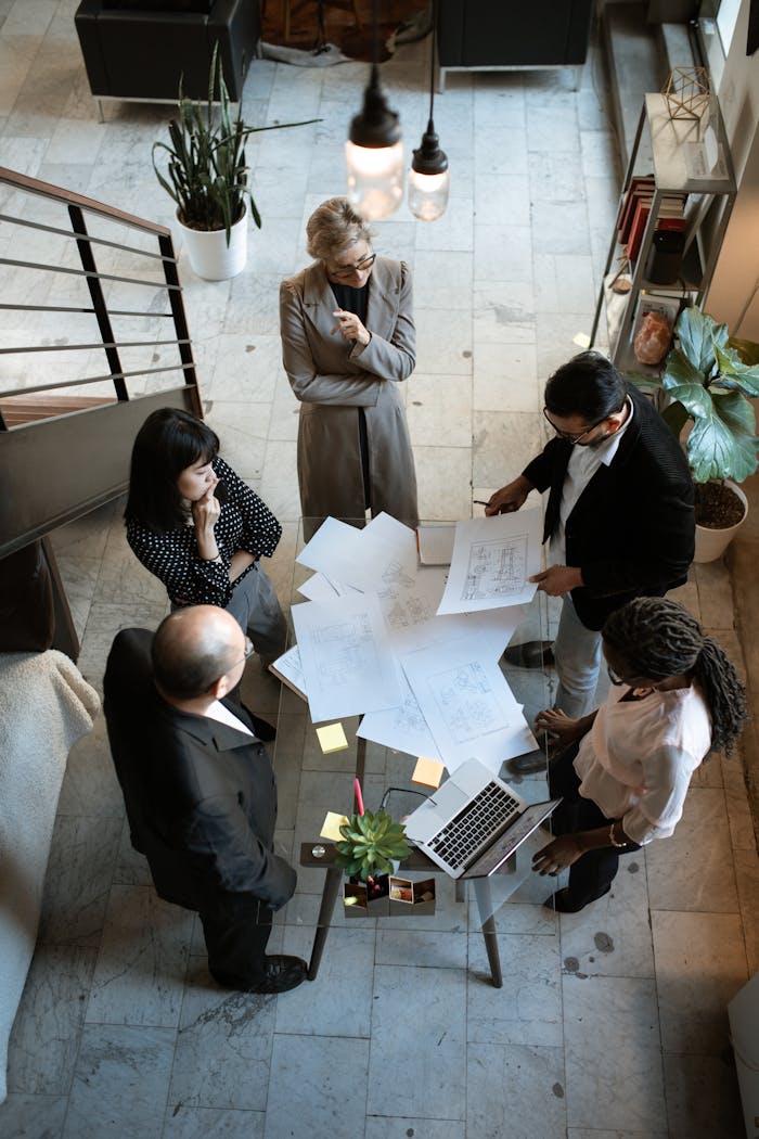gallery-01 A team of professionals engage in a business meeting in a sleek, modern office setting.